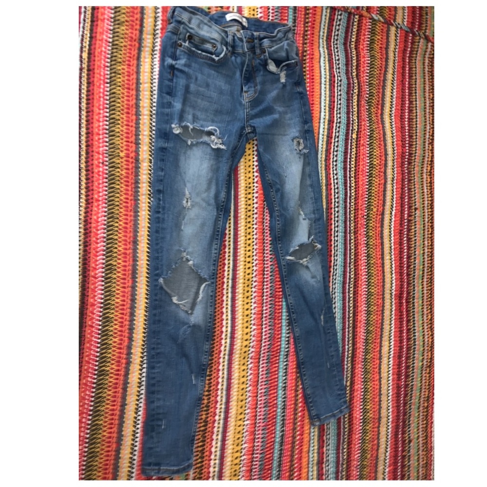 ZARA Distressed mid waist skinny jeans.